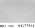 Freshly painted wall. Plaster-based exterior wall finishing material. A rough pattern finished by a plasterer. 94177641