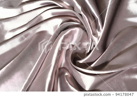 Silk Fabric Background, beige Satin Cloth Waves, Abstract Waving Textile with shining texture. woman apparel sewing concept. Silk Fabric Background, beige Satin Cloth Waves, Abstract Waving Textile with shining texture. woman apparel sewing concept. 94178047