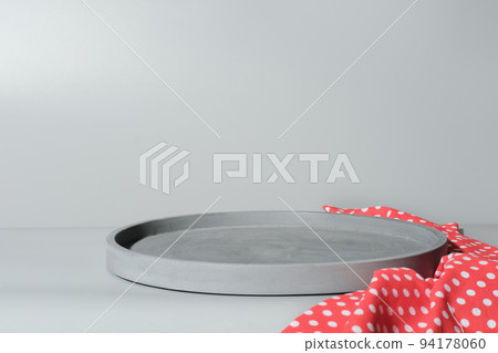 grey concrete tray made of cement as stand under plate. empty scene for food placement. mock up for food setting. red kitchen napkin 94178060