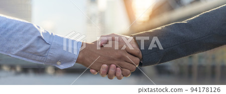 Banner Trust honesty business customer handshake together promise partner. Panorama Businessman teamwork diversity solidarity team Partner hands together. Team meeting shaking hands with copy space 94178126
