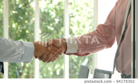 Trust honesty business customer handshake together promise respect partner. Businessman diversity solidarity team multiethnic Partner hands together teamwork. Multiracial meeting shaking hands concept 94178302
