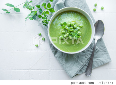 Fresh vegetable soup made of green peas 94178573