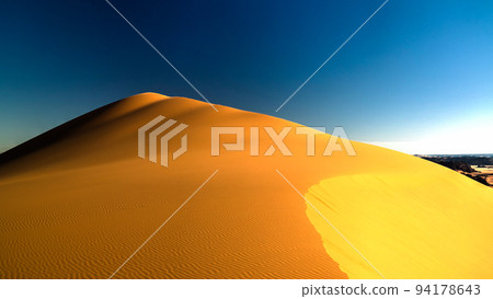 Sunset view to Tin Merzouga dune at Tassili nAjjer national park in Algeria 94178643