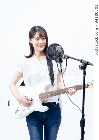 Young woman singing, electric guitar 94180303