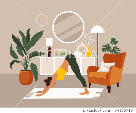 The girl does yoga or aerobics at home. The girl does yoga or aerobics at home. 94180710
