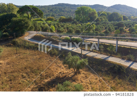 Pedestrian bridge over the road outside the city Pedestrian bridge over the road outside the city 94181828