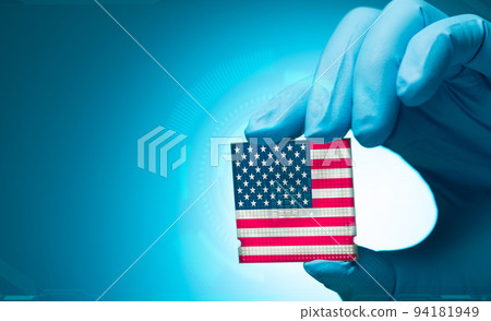Electronic engineer hand holding computer chip with American flag on blue background. Chipset of electronic circuit board. CPU chip. Computer hardware. Computer processor chip. American computer chip. 94181949