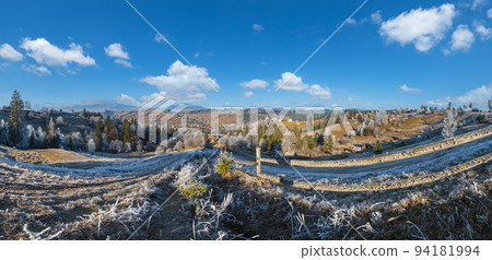 Winter coming. Last days of autumn, morning in mountain countryside peaceful picturesque hoarfrosted scene. Dirty road from hills to the village. Ukraine, Carpathian mountains. Winter coming. Last days of autumn, morning in mountain countryside peaceful picturesque hoarfrosted scene. Dirty road from hills to the village. Ukraine, Carpathian mountains. 94181994
