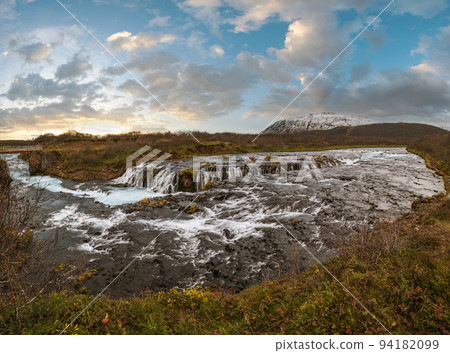Picturesque waterfall Bruarfoss autumn view. Season changing in southern Highlands of Iceland. 94182099