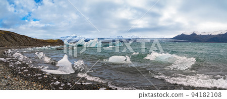 Jokulsarlon glacial lake, lagoon with ice blocks, Iceland. Situated near the edge of the Atlantic Ocean at the head of the Breidamerkurjokull glacier, Vatnajokull icecap or Vatna Glacier. Jokulsarlon glacial lake, lagoon with ice blocks, Iceland. Situated near the edge of the Atlantic Ocean at the head of the Breidamerkurjokull glacier, Vatnajokull icecap or Vatna Glacier. 94182108