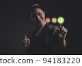 Asian woman voting and pressing smile face emoticon on virtual touch screen, isolated on background. 94183220