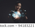 Asian woman showing a growing virtual hologram of statistics, graph and chart. 94183221