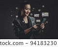 Asian woman using smart phone for check feedback, reviews with comments icon hologram effect. 94183230