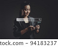 Asian woman using smart phone for searching with browser icon hologram effect. 94183237