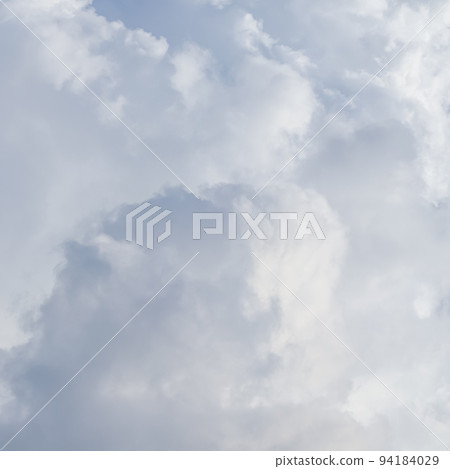 Cloudy sky background with sunlight shining through white clouds. Natural backdrop Cloudy sky background with sunlight shining through white clouds. Natural backdrop 94184029