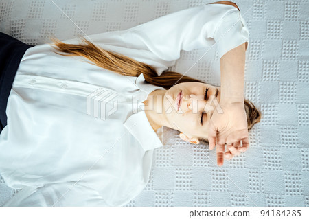 Migraine Headaches At Work, Frequent Headache and Work Ability. Exhausted, Tired Businesswoman with headache after work sitting on bed at home. Business woman at office feeling sick at work Migraine Headaches At Work, Frequent Headache and Work Ability. Exhausted, Tired Businesswoman with headache after work sitting on bed at home. Business woman at office feeling sick at work 94184285