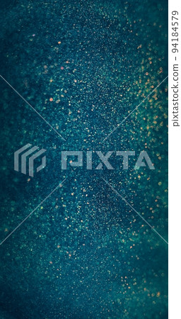 Defocused light. Glitter background. Bokeh flare. Blur orange blue color shimmering round particles glare on decorative abstract poster. 94184579