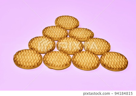 Sweet dessert cookies crekers triangle are a tasty product.Isolated on pink Sweet dessert cookies crekers triangle are a tasty product.Isolated on pink 94184815