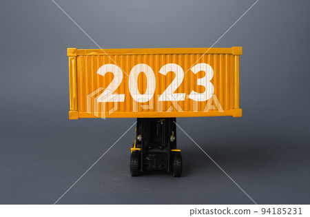 Forklift with a shipping container with 2023. Analytics forecasting of freight traffic next year. Develop infrastructure projects. Express delivery, goods transportation. Logistics. Import export. 94185231
