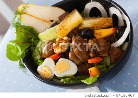 Salad of chicken hearts with peach, pear, fried cheese, quail eggs Salad of chicken hearts with peach, pear, fried cheese, quail eggs 94185407