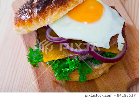 Cheeseburger with fried egg Cheeseburger with fried egg 94185537