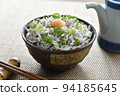Whitebait rice bowl topped with ginger, chopsticks and soy sauce jug 94185645