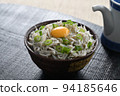 Whitebait rice bowl topped with egg and soy sauce jug 94185646