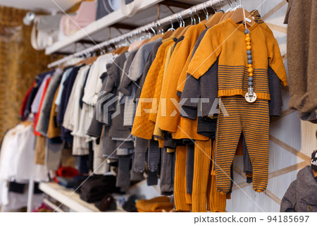 Stand with many baby costumes Stand with many baby costumes 94185697