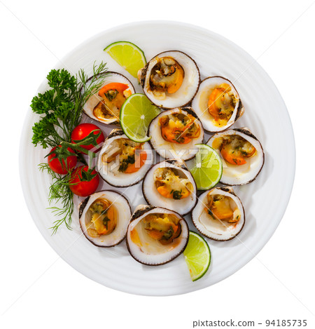 Baked in oven with sauce dog cockle with lemon and fresh greens 94185735