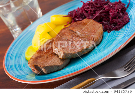 Roasted veal hip with boiled potato Roasted veal hip with boiled potato 94185789