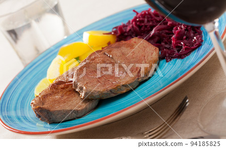 Beef steaks with potatoes and pickled cabbage Beef steaks with potatoes and pickled cabbage 94185825