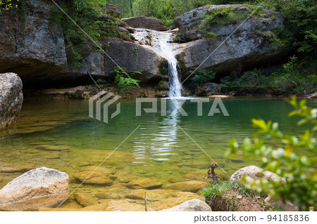 Waterfall in Catalonia surrounded by beautiful forests Waterfall in Catalonia surrounded by beautiful forests 94185836