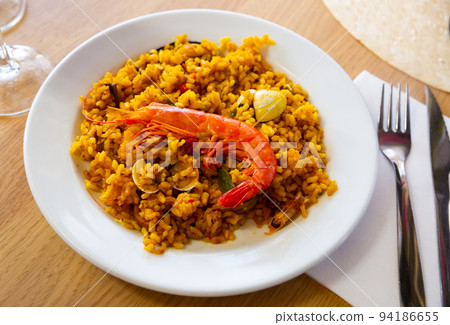 Seafood paella with shrimps and clams Seafood paella with shrimps and clams 94186655