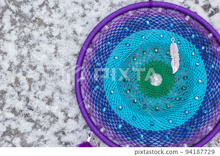 Dreamcatcher made of feathers, leather, beads, and ropes Dreamcatcher made of feathers, leather, beads, and ropes 94187729