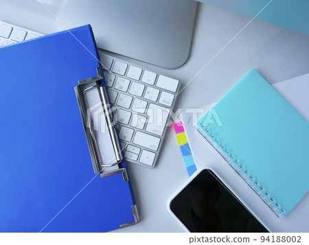Business image of binders, documents, notebooks, personal computers, smartphones 94188002