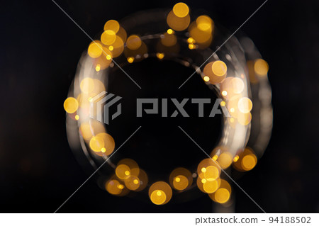 Fairy lights, led garland, blurred overhead flat lay shot with bokeh on black 94188502