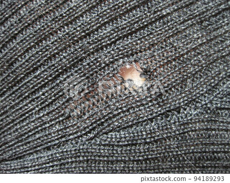 Sweater with holes eaten by insects Sweater with holes eaten by insects 94189293