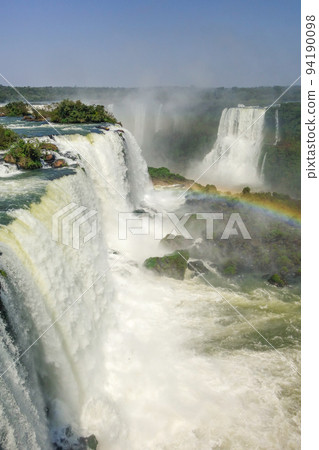 magnificent Iguazu falls, in Brazil Argentina border. One of 7 Wonders of Nature magnificent Iguazu falls, in Brazil Argentina border. One of 7 Wonders of Nature 94190098