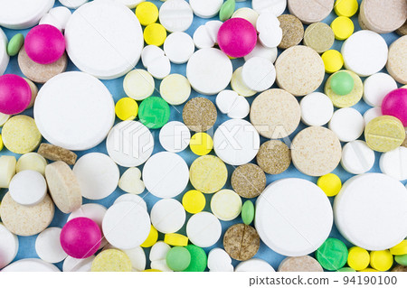 pills on a blue background pills on a blue background 94190100