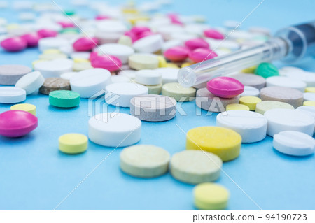 pills on a blue background pills on a blue background 94190723