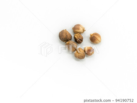 Close-up and top view image of dried Cardamon on white background, a small group of dried Cardamon. Close-up and top view image of dried Cardamon on white background, a small group of dried Cardamon. 94190752