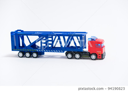 Toy car transporter with cars with place for text, copy space, for a toy store. Toy car transporter with cars with place for text, copy space, for a toy store. 94190823