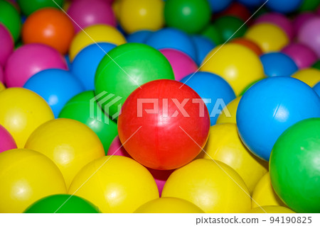Colorful balls in the pool with balls in the playroom. Colorful balls in the pool with balls in the playroom. 94190825