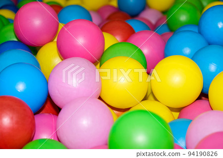 Colorful balls in the pool with balls in the playroom. Colorful balls in the pool with balls in the playroom. 94190826