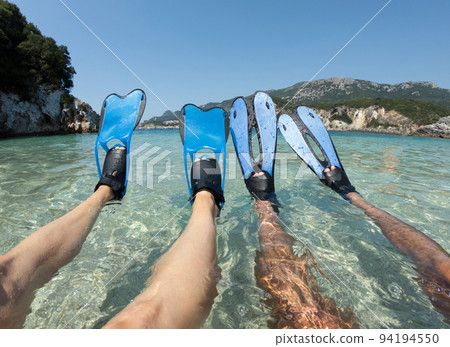 Snorkeler couple with blue flippers 94194550