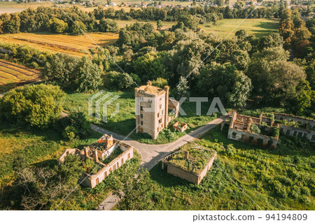 Aerial View Remains Of Yastrzhembsky Estate And Park Complex. Top View Of Old Five-storey Brick Water Tower. Drone View Of Beautiful European Nature From High Attitude In Summer Season. Bird's Eye Aerial View Remains Of Yastrzhembsky Estate And Park Complex. Top View Of Old Five-storey Brick Water Tower. Drone View Of Beautiful European Nature From High Attitude In Summer Season. Bird's Eye 94194809