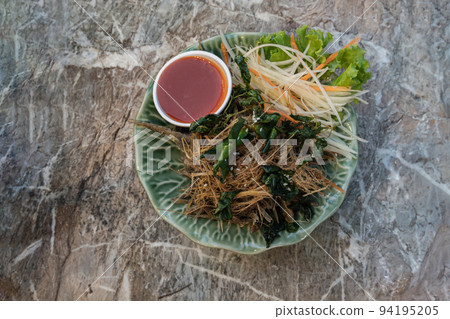 Deep fried horseface loach fish fried or Crispy fried Banana-root fishes. 94195205