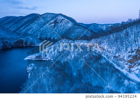Aerial of a lake at winter during blue hour 94195224
