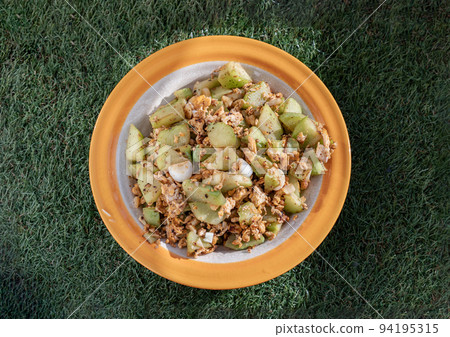 Stir fried Chayote with Eggs in Oyster sauce on Ceramic plate. Stir fried Chayote with Eggs in Oyster sauce on Ceramic plate. 94195315