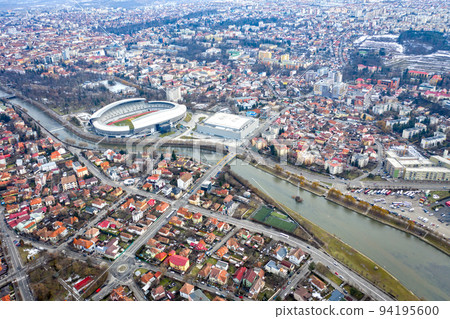 Aerial above view of river crossing the city 94195600